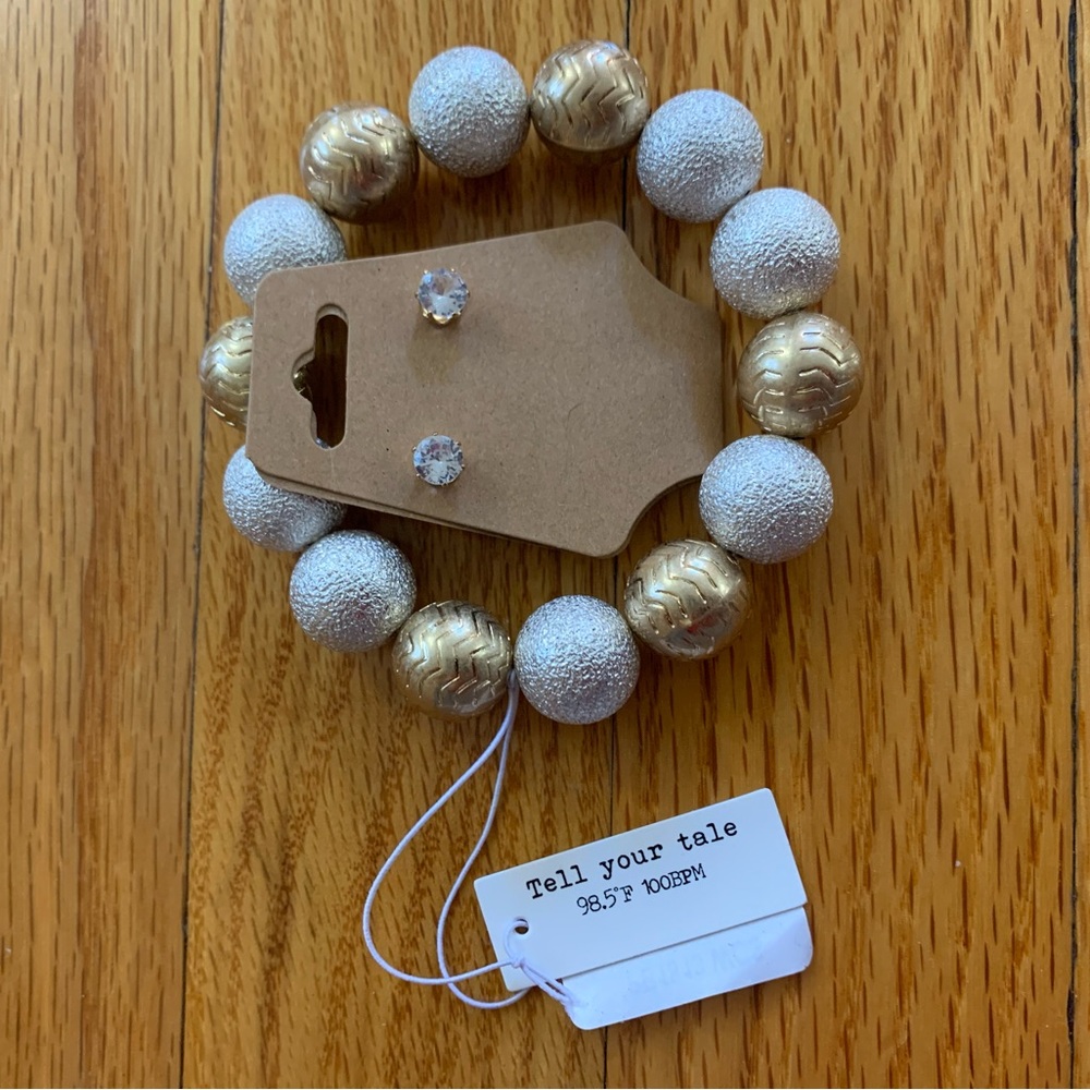 Tell Your Tale bracelet and unbranded pair of earrings. NWT.